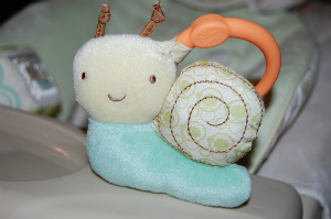 How cute is this?  Two soft, plush toys attach to the tray with anchors.  Genius!